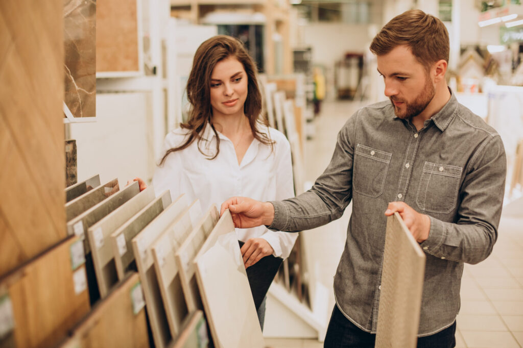 young couple choosing tiles building market scaled.jpg